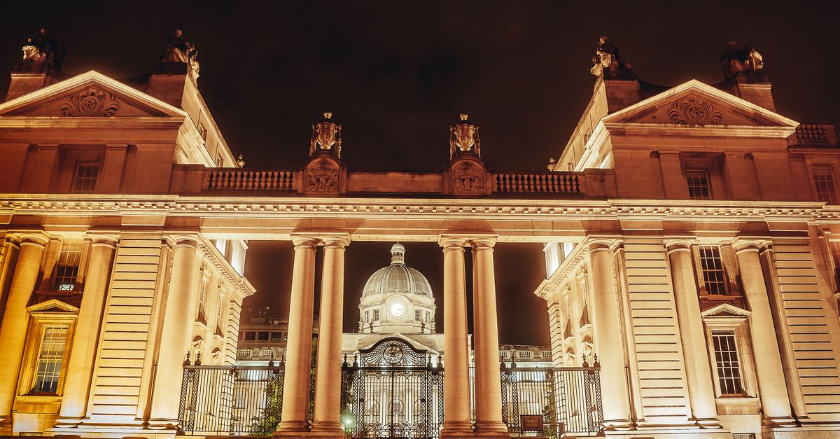 Stunning night view of a richly ornamented building illuminated against the dark sky.