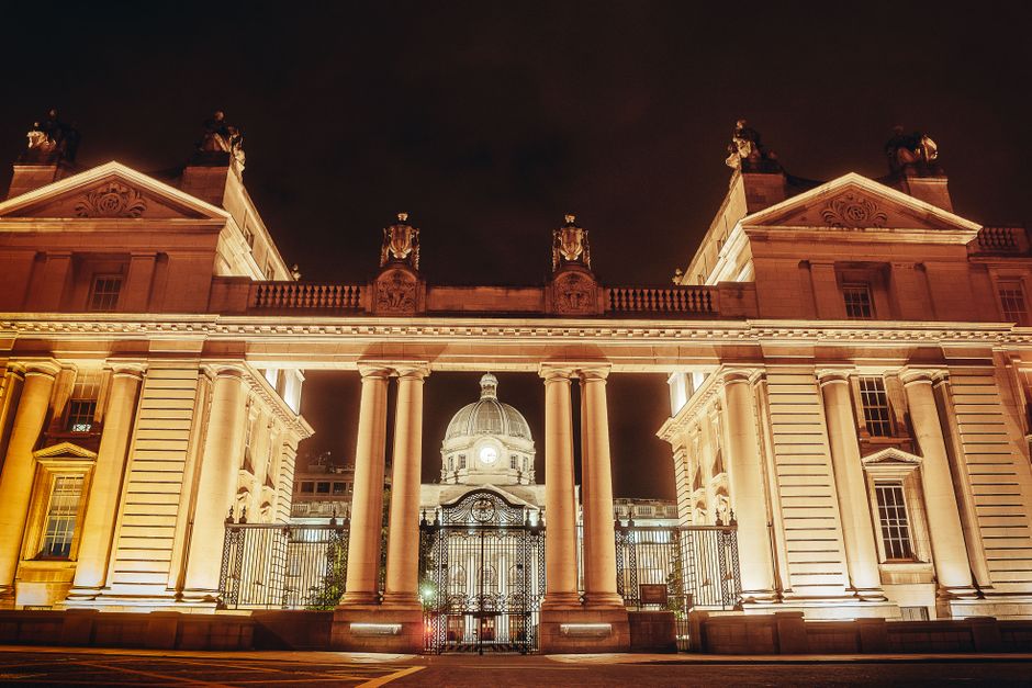 Stunning night view of a richly ornamented building illuminated against the dark sky.