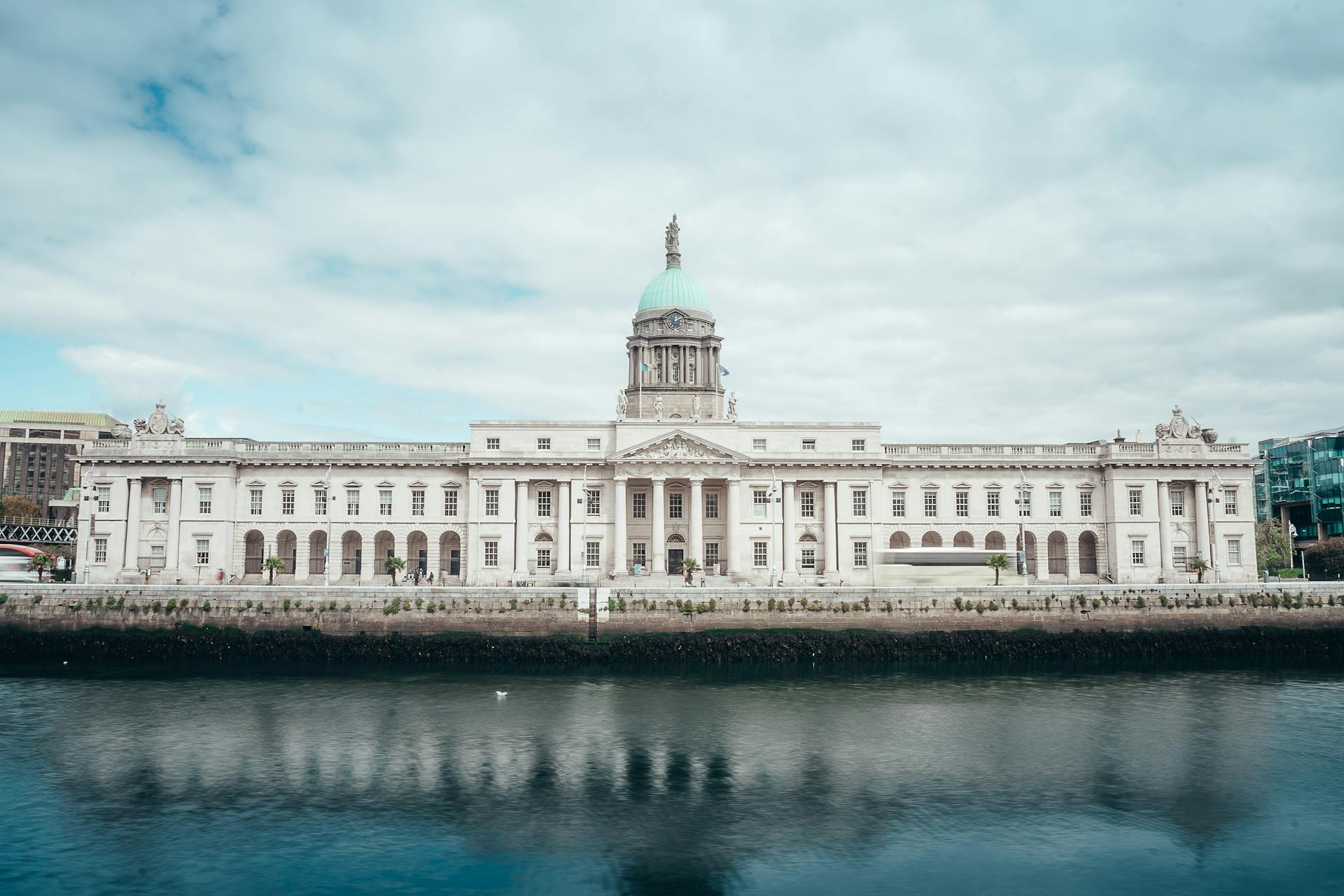 A scenic view of the historic Custom House reflecting in the River Liffey in Dublin, Ireland.