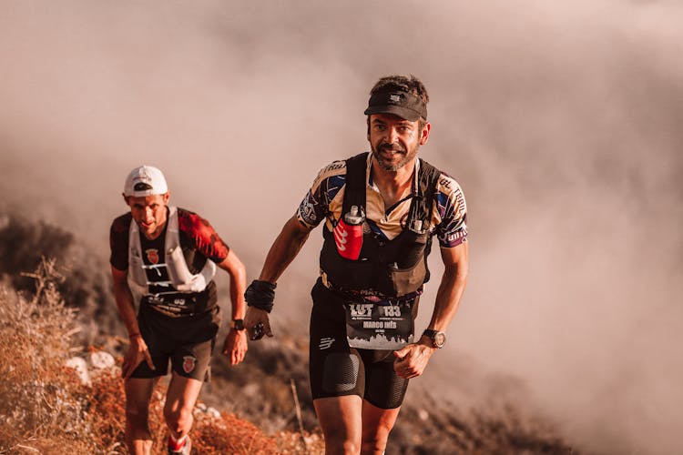 Mountain Climbers Walking On A Trail