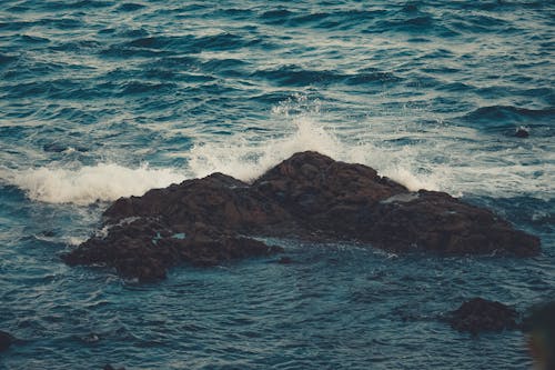 An Ocean Waves Crashing on a Rock Formation