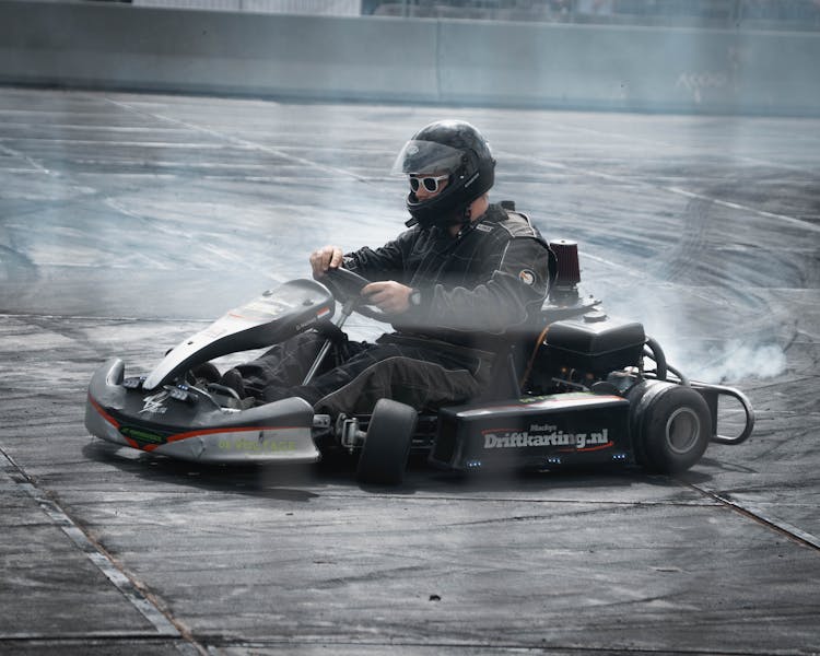 A Man Drifting With A Go Kart