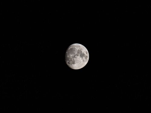 Free High-resolution image of the moon surrounded by a starlit night sky. Stock Photo