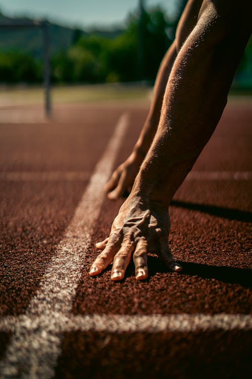 A Close-Up Shot of an Athlete on a Race Track