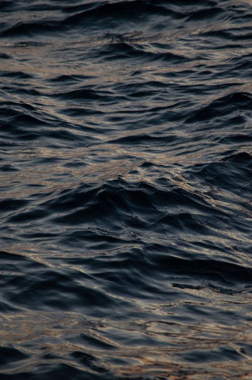 Free A close-up view of the dark ocean waves at dusk, capturing the natural beauty of Istanbul's coastal waters. Stock Photo