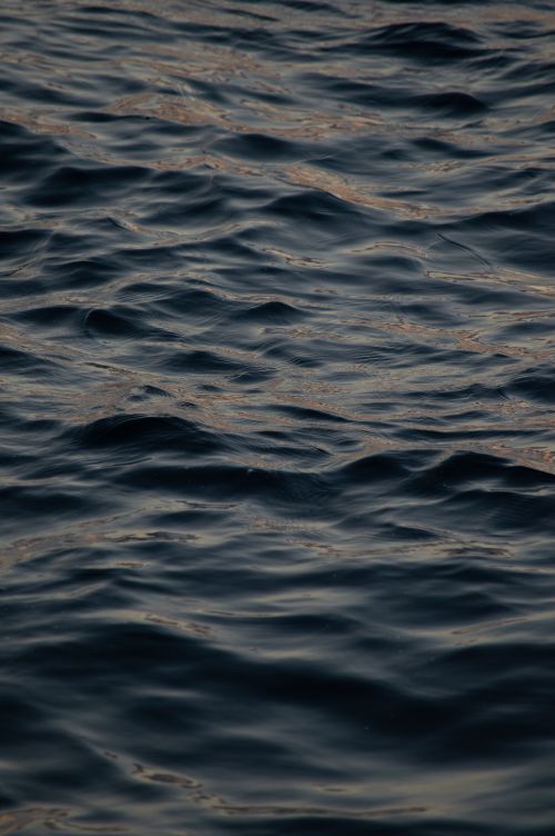 Free Peaceful ripples of Bosphorus water at sunset in Istanbul, Turkey, capturing a serene maritime ambiance. Stock Photo