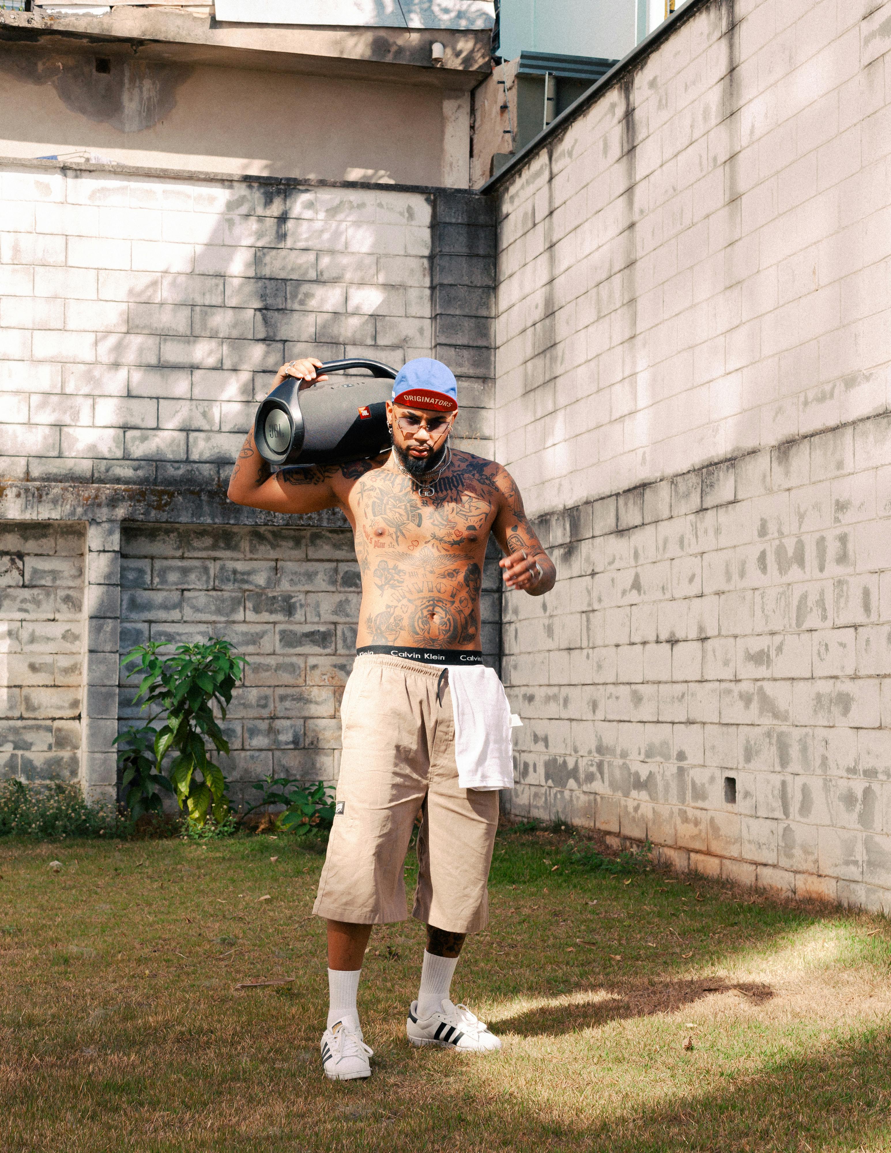 Portrait of Rapper on Dollar Wall Background · Free Stock Photo