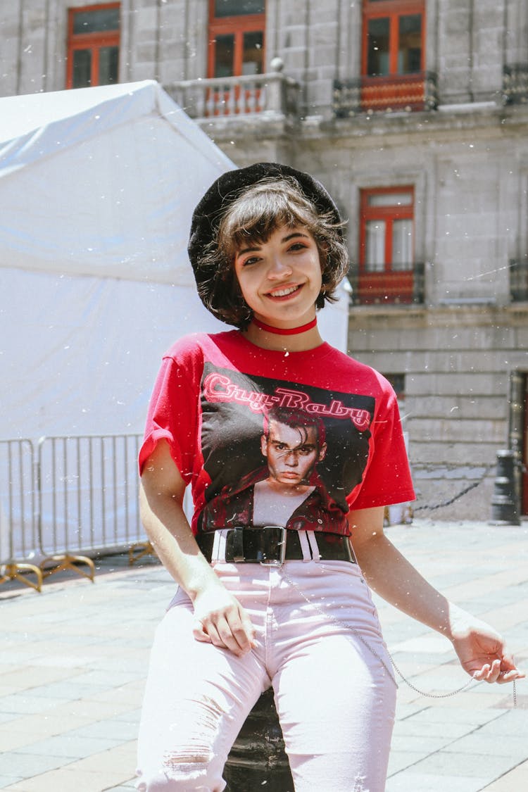 Portrait Of Girl In Beret Sitting Outside