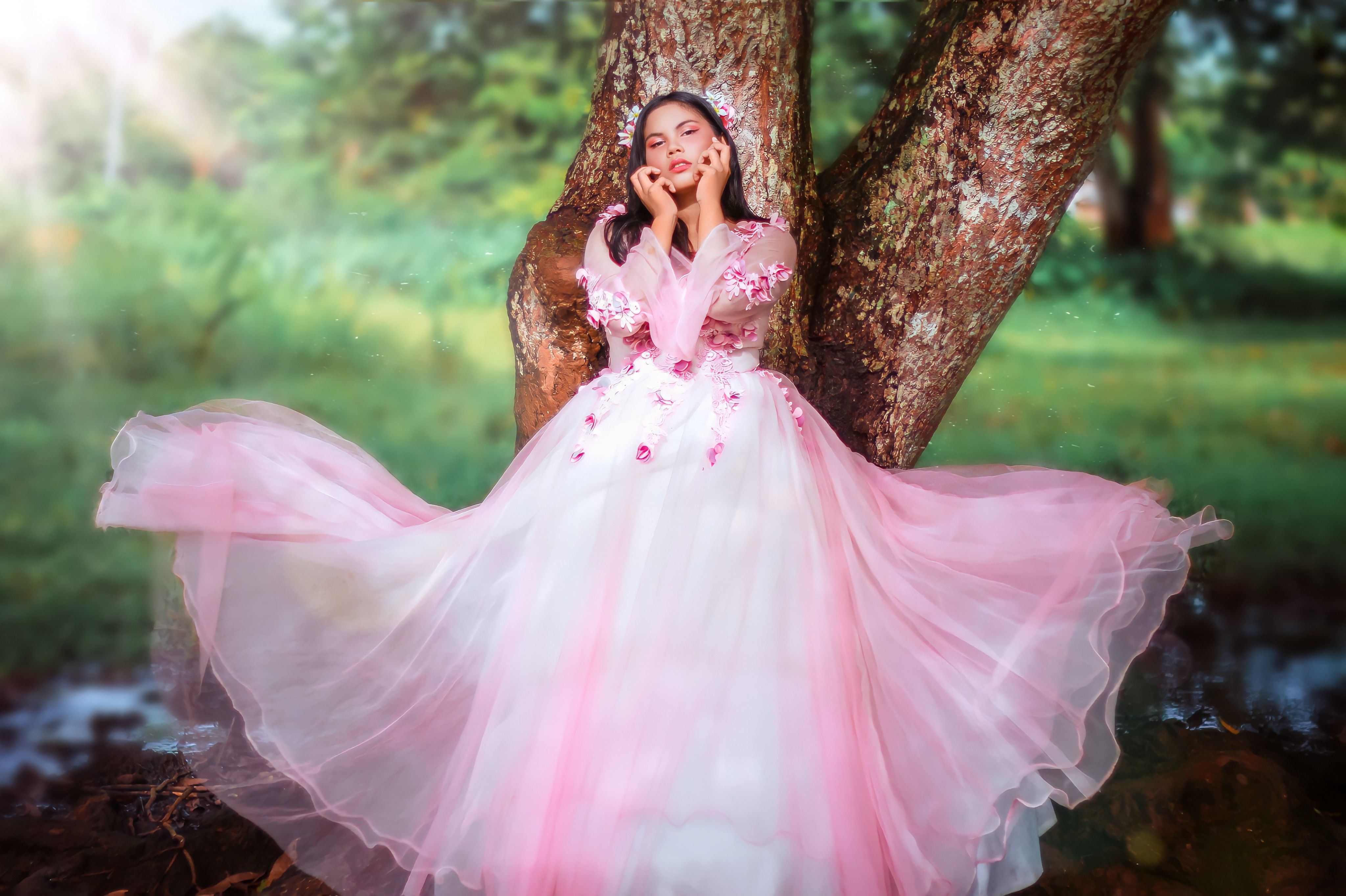 Woman in Pink Dress leaning on Brown Tree · Free Stock Photo