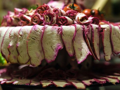 Close-up of artisanal cured meats with vibrant colors, perfect for culinary enthusiasts.