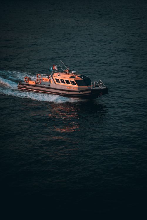 Free A dynamic aerial shot of a boat speeding across the calm waters of Istanbul, Turkey. Stock Photo