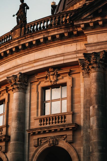 Close-up shot of Bode Museum's facade in Berlin, captured during sunset with intricate architectural details.