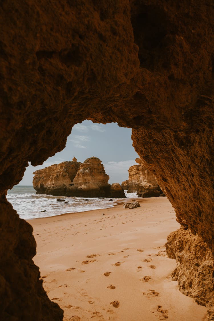 Cave On Sand Beach On Seashore