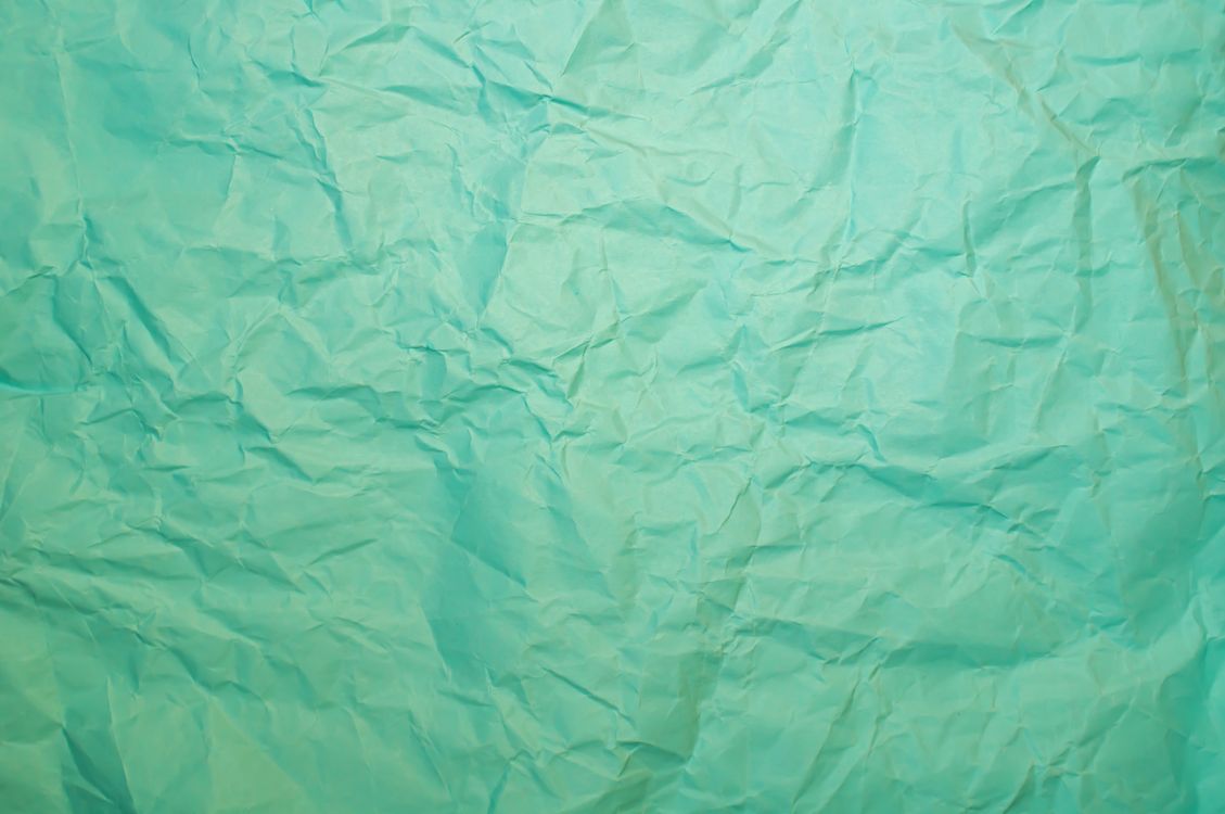 Teal Creased Paper in Close Up Shot · Free Stock Photo
