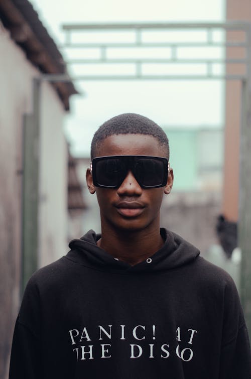 A Man in Black Hoodie Wearing Sunglasses