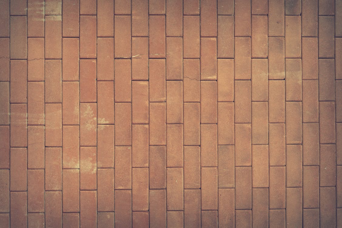無料 茶色のコンクリートレンガの壁 写真素材