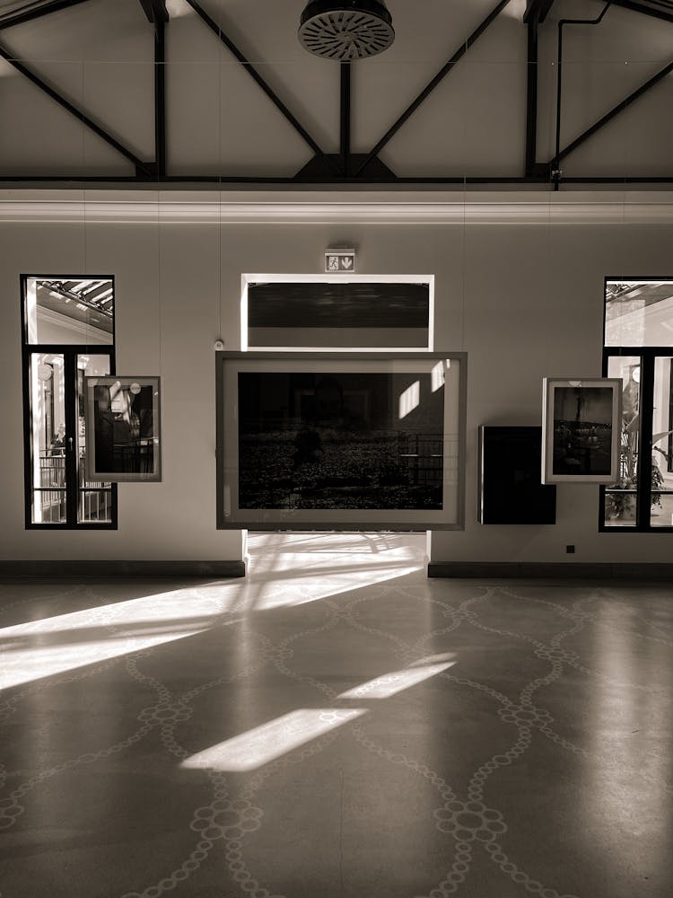 Empty Room With Hanging Frames On The Wall