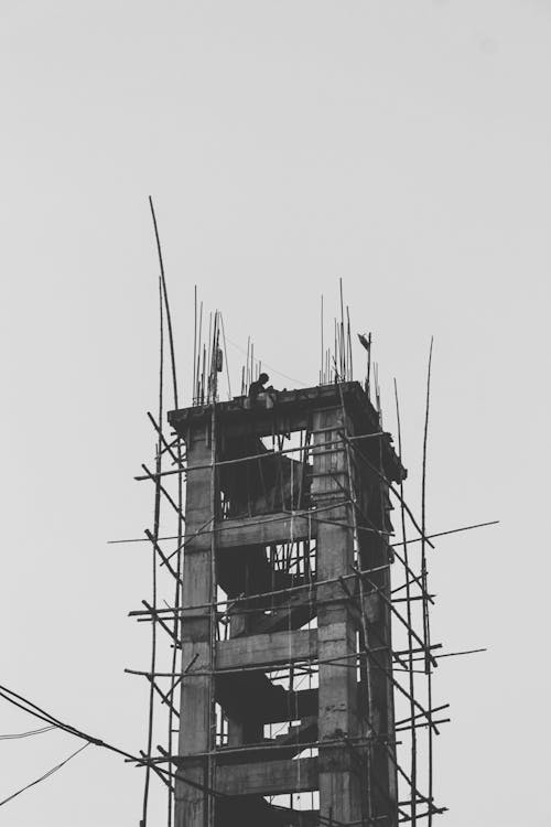 Grayscale Photo of Building Construction