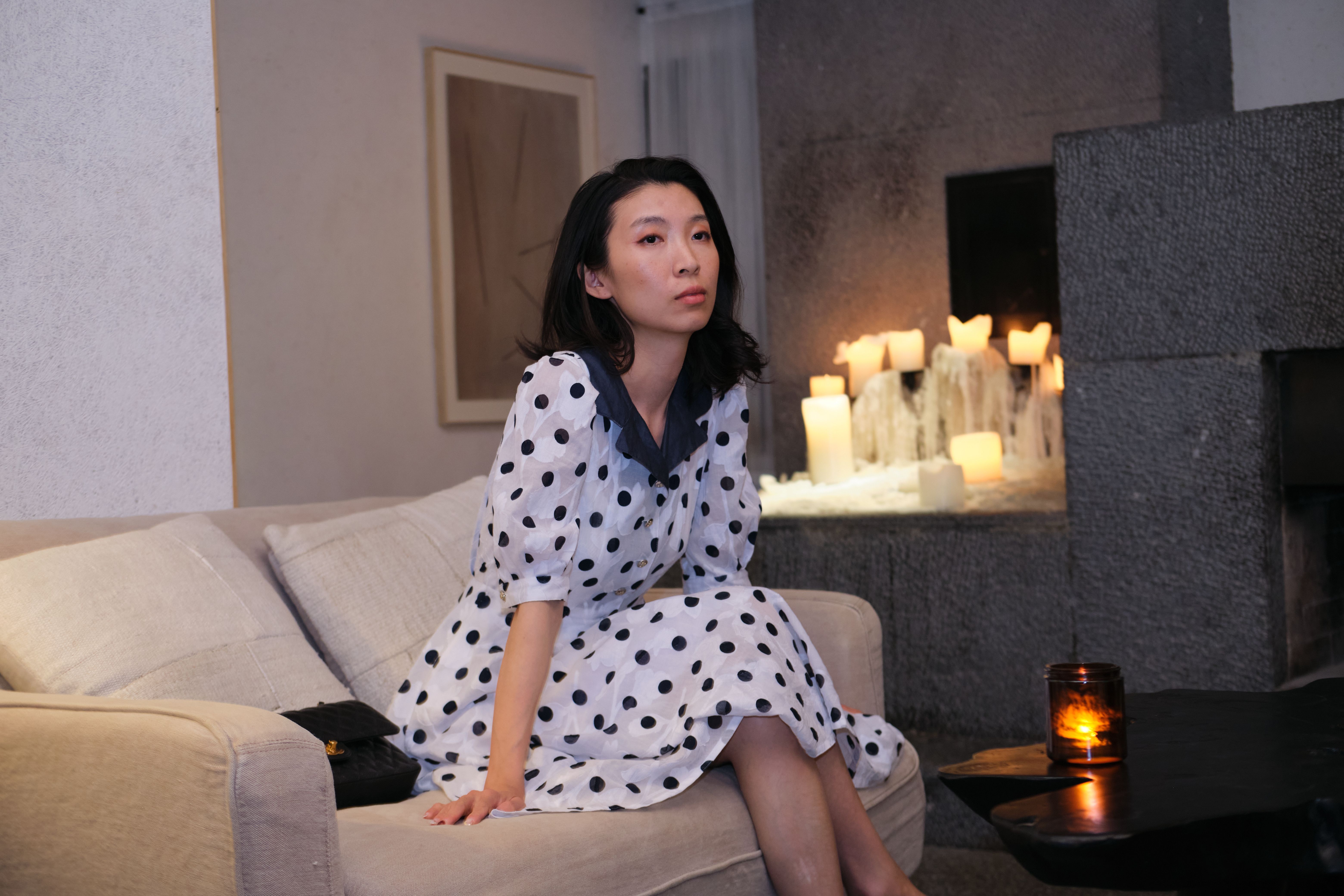 A midi polka dot dress styled with subtle accessories