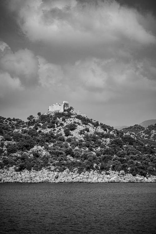 Grayscale Photo of a Lake and Mountain