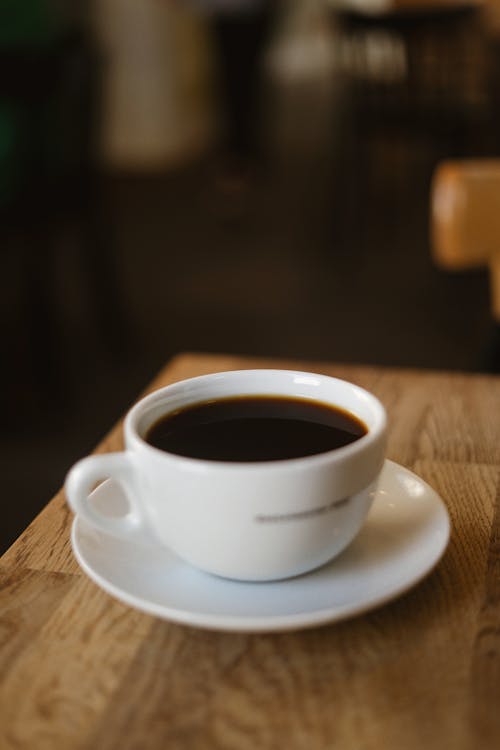 Free Cup of Coffee on White Saucer Stock Photo