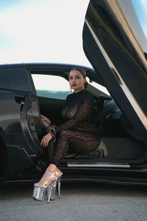 Woman Sitting on Car's Seat