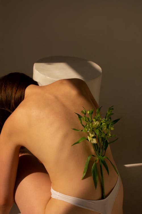 Free Flowers on Woman Back Stock Photo