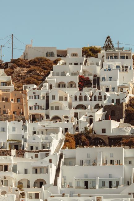 Stunning view of Santorini's iconic whitewashed buildings cascading down a hill.