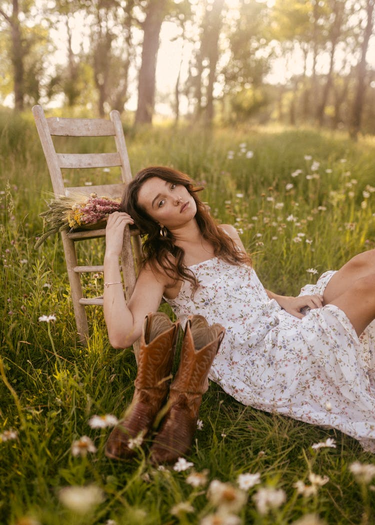 Woman Lying Down On Meadow