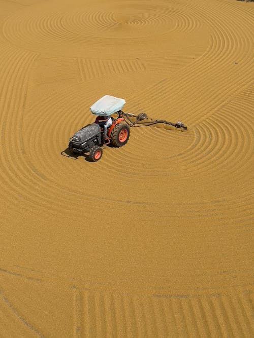 Black and Orange Tractor on Brown Desert