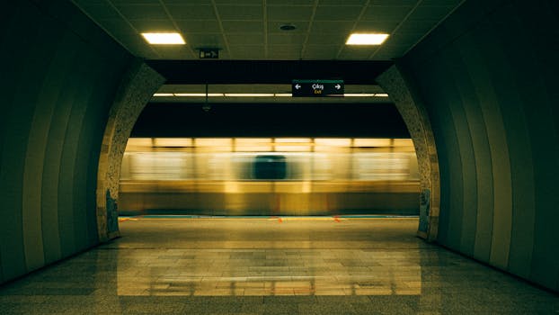 Blurred motion of a subway train passing through an Istanbul metro station, highlighting urban speed and travel.