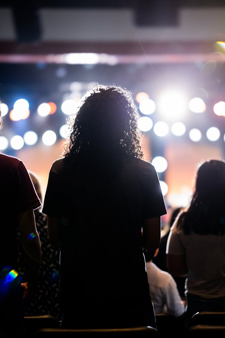 A Crowd Of People Attending An Event