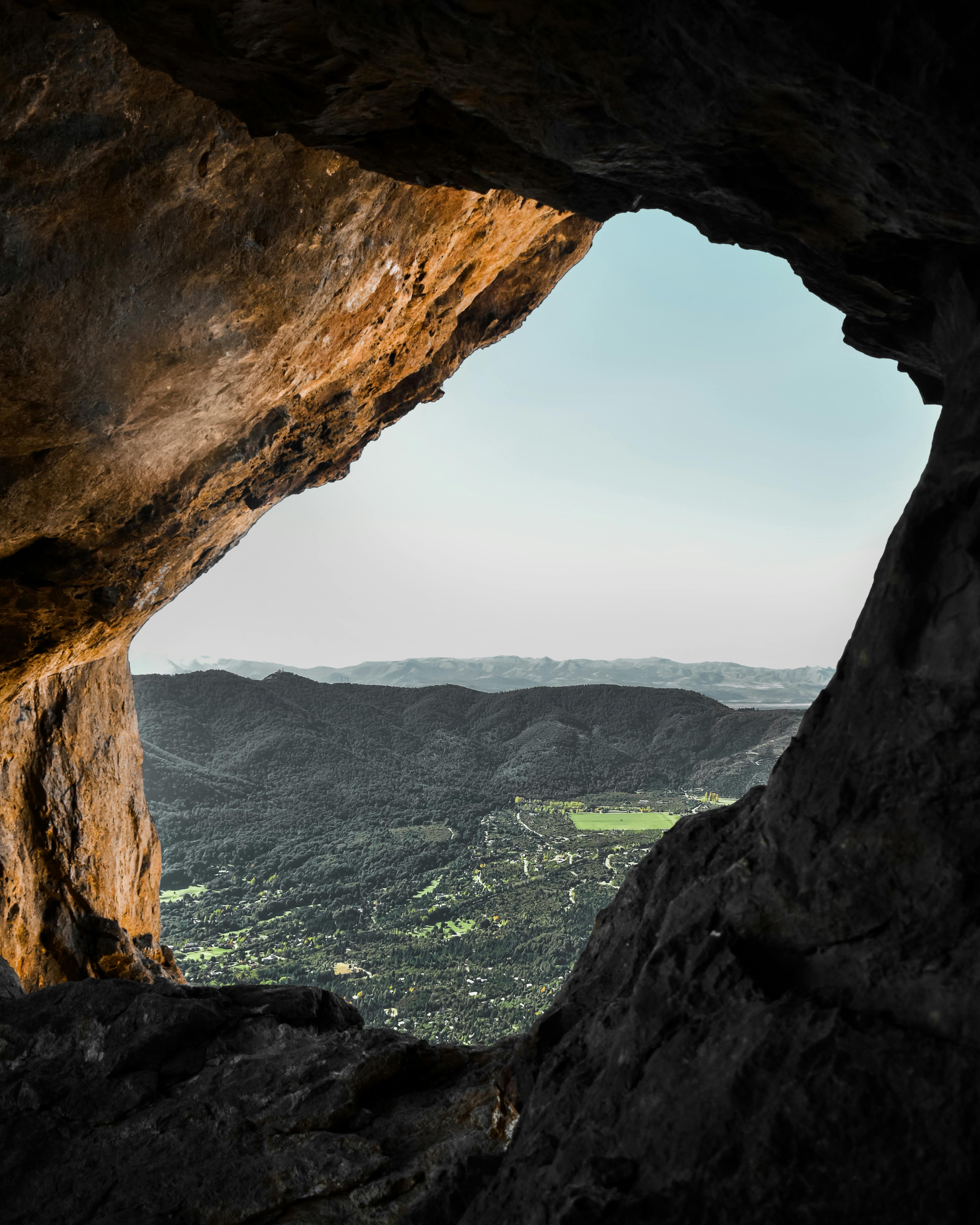 Stunning landscape view from inside a cave overlooking San Carlos de Bariloche, Argentina.