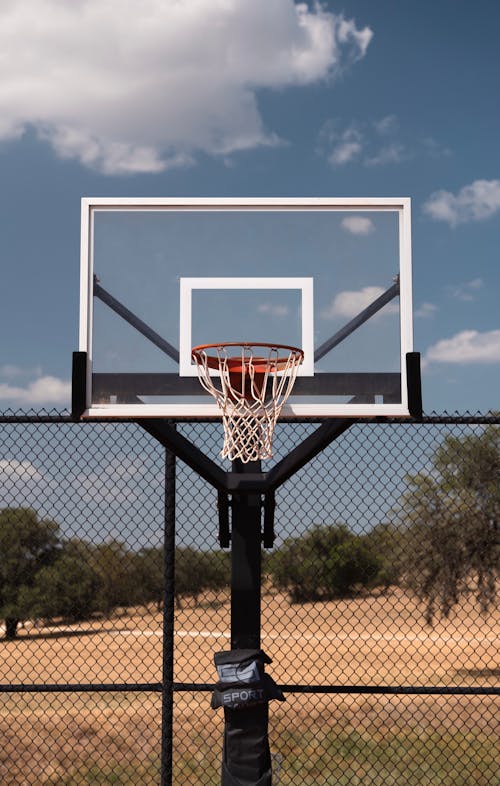 Black and White Basketball Hoop under Blue Sky