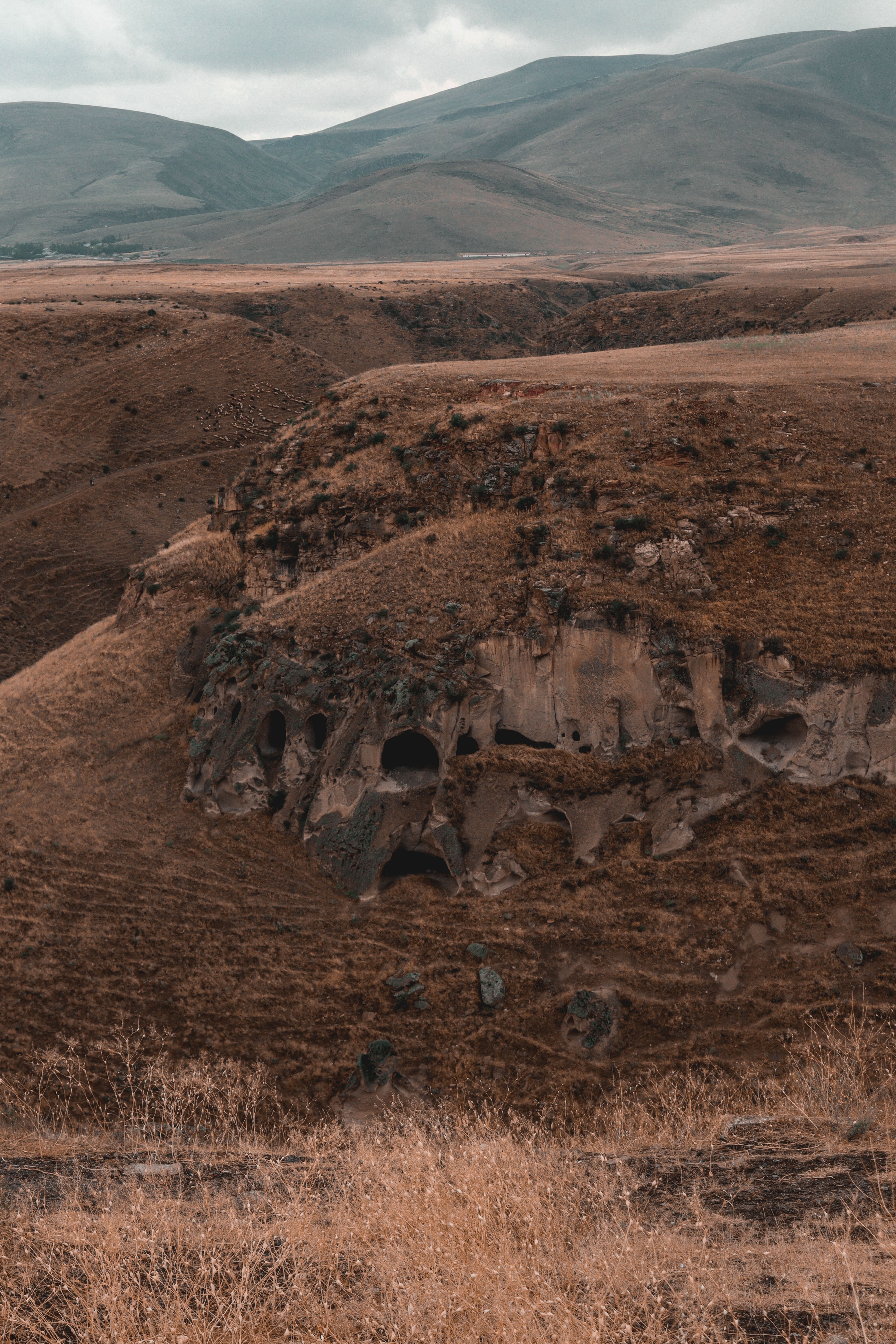 A dramatic landscape of barren hills with rugged terrain, perfect for nature and travel visuals.