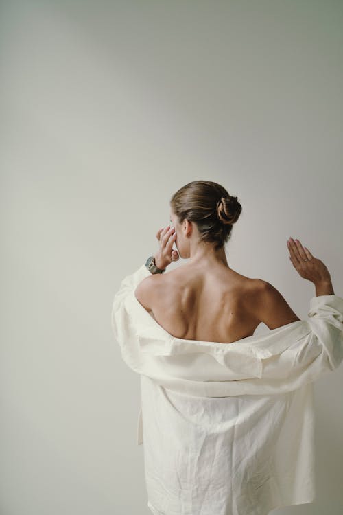 Back View of Woman in White Shirt