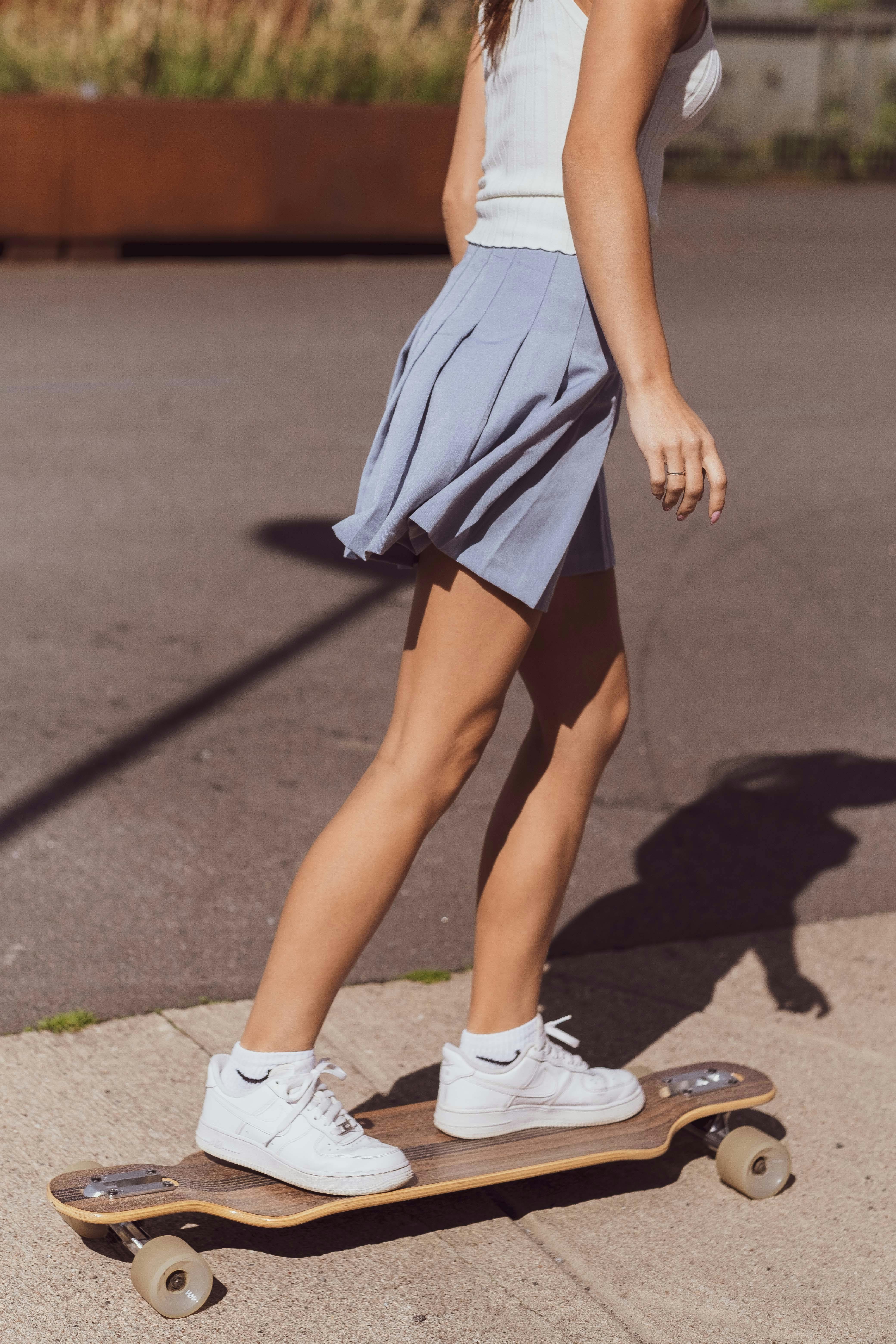 woman riding longboard