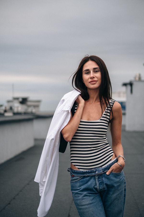 Medium-wash straight-leg jeans with striped top
