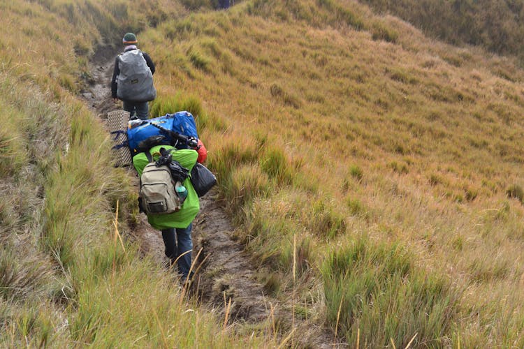 2 Person Climbing Mountain