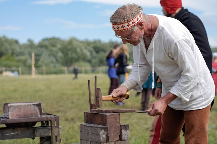 A Blacksmith Holding A Hammer