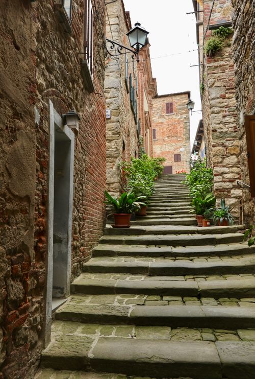 Free Explore the stone staircase and historic architecture of Lucignano, Tuscany, Italy. Stock Photo