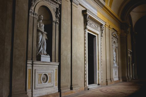 Free A serene marble sculpture adorns a classical museum hallway, highlighting historical artistry. Stock Photo