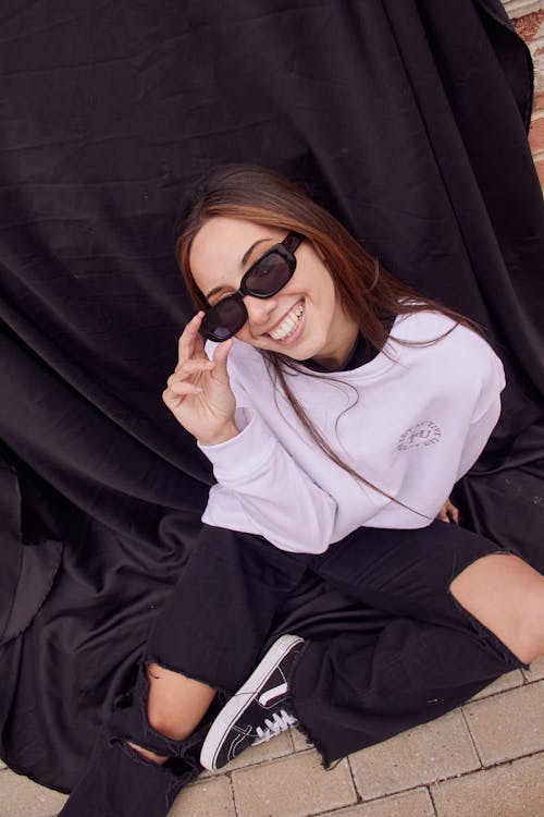 High-Angle Shot of a Beautiful Woman Wearing Black Sunglasses