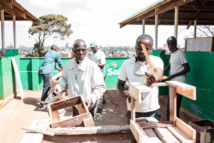 Carpenters Working In A Workshop 