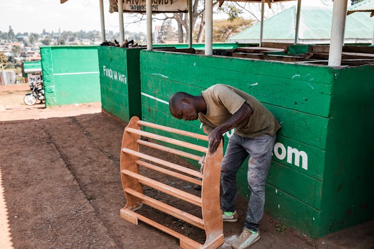 Worker Polishing Wood