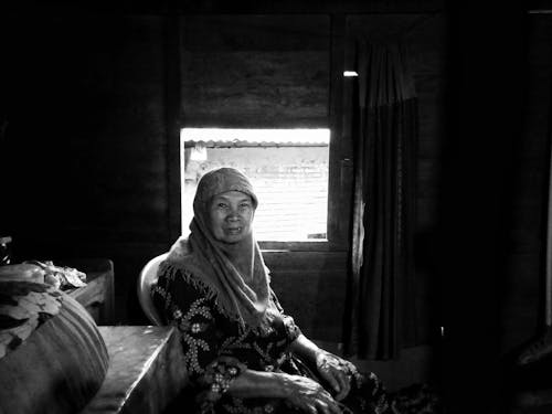 Grayscale Photo of an Elderly Woman
