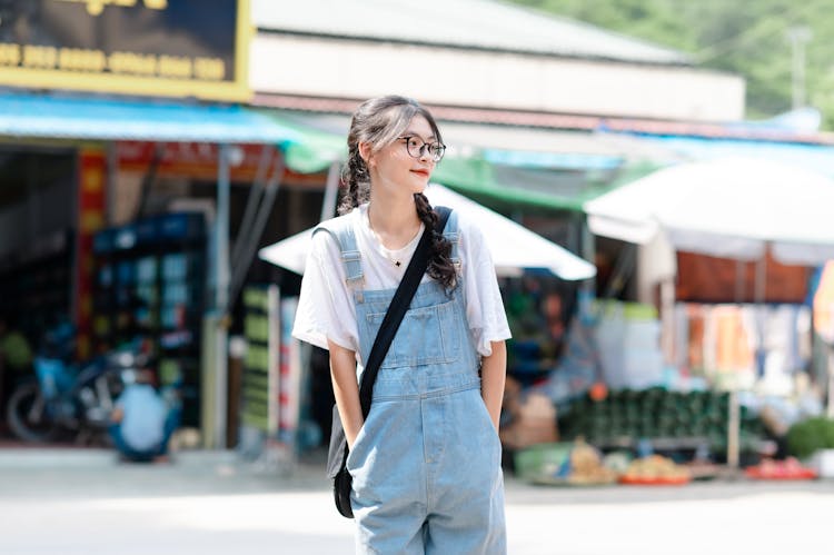 Woman In Denim Overalls