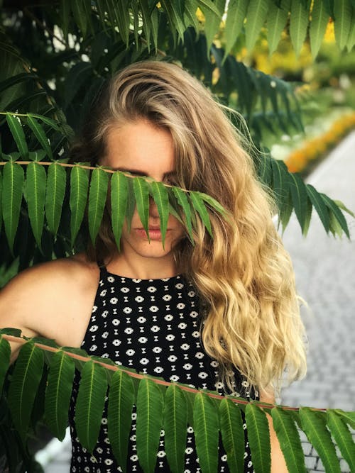 Woman Behind Leaves