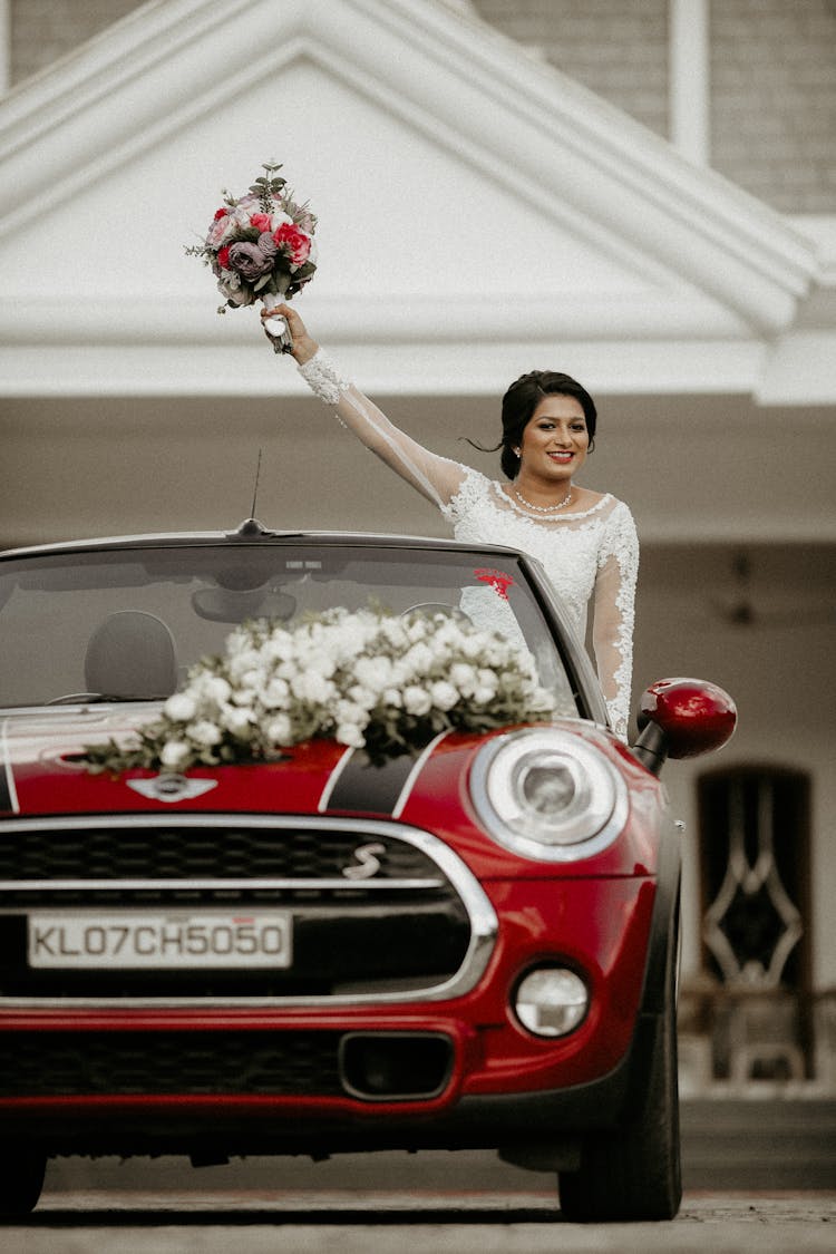 Happy Bride With Bouquet Of Flowers