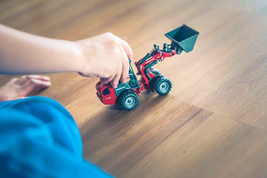 Free Red and Black Plastic Toy Car Stock Photo